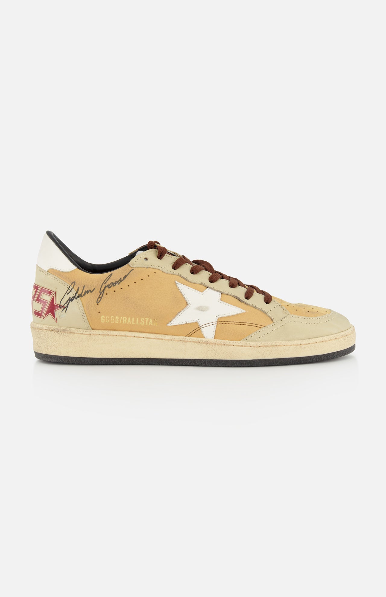 The GOLDEN GOOSE Ballstar Nabuk Upper And Tongue Sneaker features a tan and beige design, brown leather laces, white star logo, red heel lettering, black signature, and GGDB/BALLSTAR text on the side.
