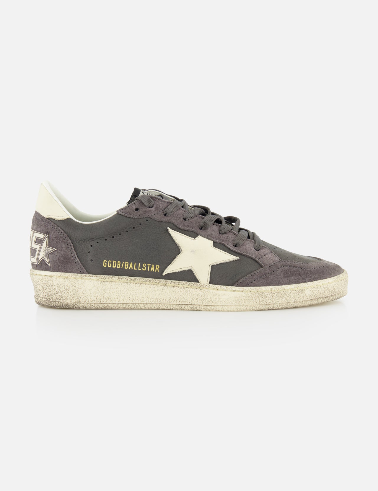 The Ballstar Nabuk Upper Suede Sneaker by GOLDEN GOOSE is a gray men’s low-top with a white star logo, white heel tab, worn-effect sole, and “GGDB/BALLSTAR” in gold near the laces.