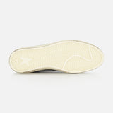 The image features the underside of a GOLDEN GOOSE Ballstar Nabuk Upper Suede Sneaker in beige leather, showing its textured herringbone sole against a plain white background—a refined touch typical of men's designer footwear.