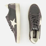 The GOLDEN GOOSE Ballstar Nabuk Upper Suede Sneaker is a men's designer shoe in dark gray leather with white soles, star-shaped accents, and white heel details, shown from side and top view on a plain white background.