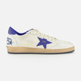 The Ballstar Nappa Upper Sneaker by GOLDEN GOOSE is a white leather sneaker featuring a blue star on the side, blue heel detail, beige scuffed sole, and gold GGBD/BALLSTAR text near the laces.