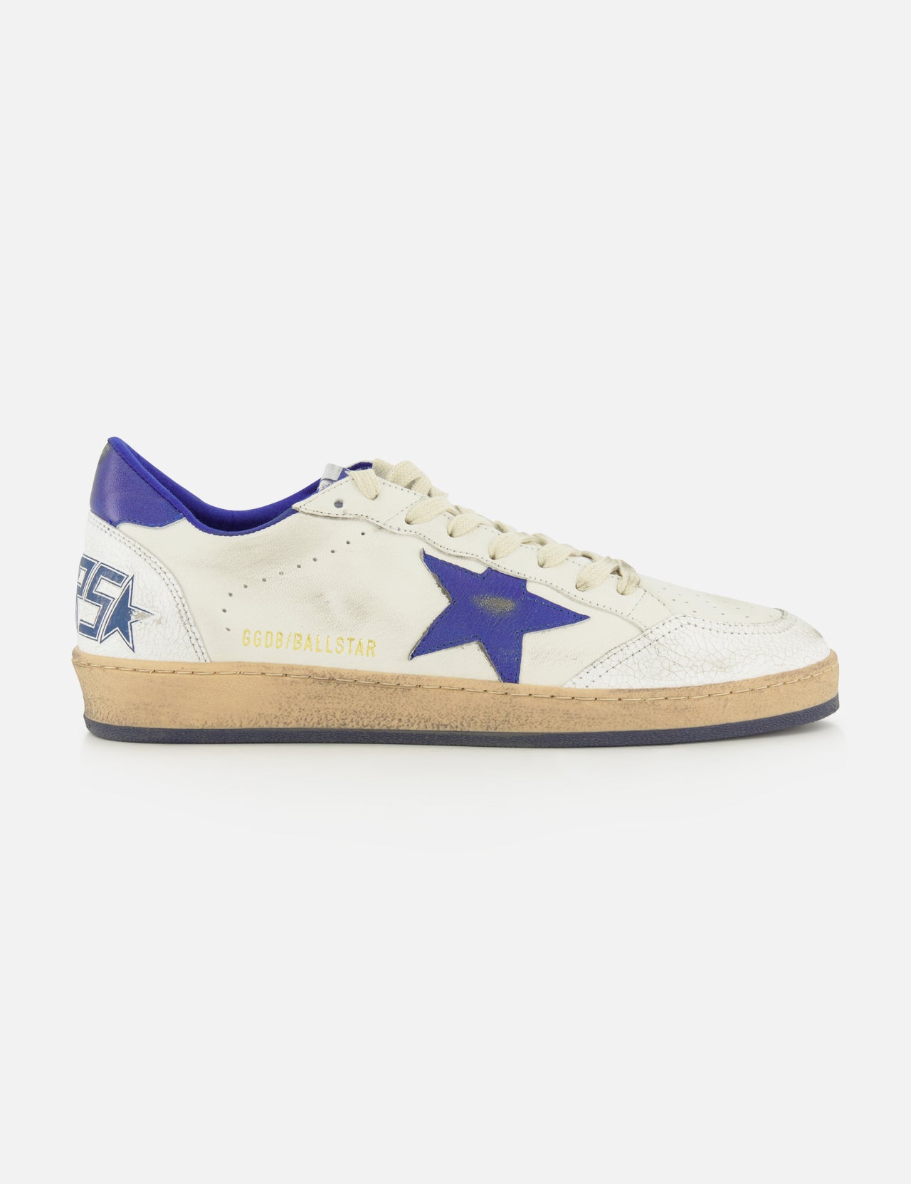 The Ballstar Nappa Upper Sneaker by GOLDEN GOOSE is a white leather sneaker featuring a blue star on the side, blue heel detail, beige scuffed sole, and gold GGBD/BALLSTAR text near the laces.