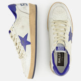 A pair of GOLDEN GOOSE Ballstar Nappa Upper Sneakers in off-white leather with blue accents, signature side star detailing, and beige soles with a deliberately distressed finish. One sneaker is displayed from the side and the other from above, both set against a plain white background.