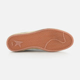 A close-up of the GOLDEN GOOSE Ballstar Suede Upper Sneaker sole shows a light reddish-brown herringbone pattern and visible logo on the scuffed bottom, set against a plain white background.