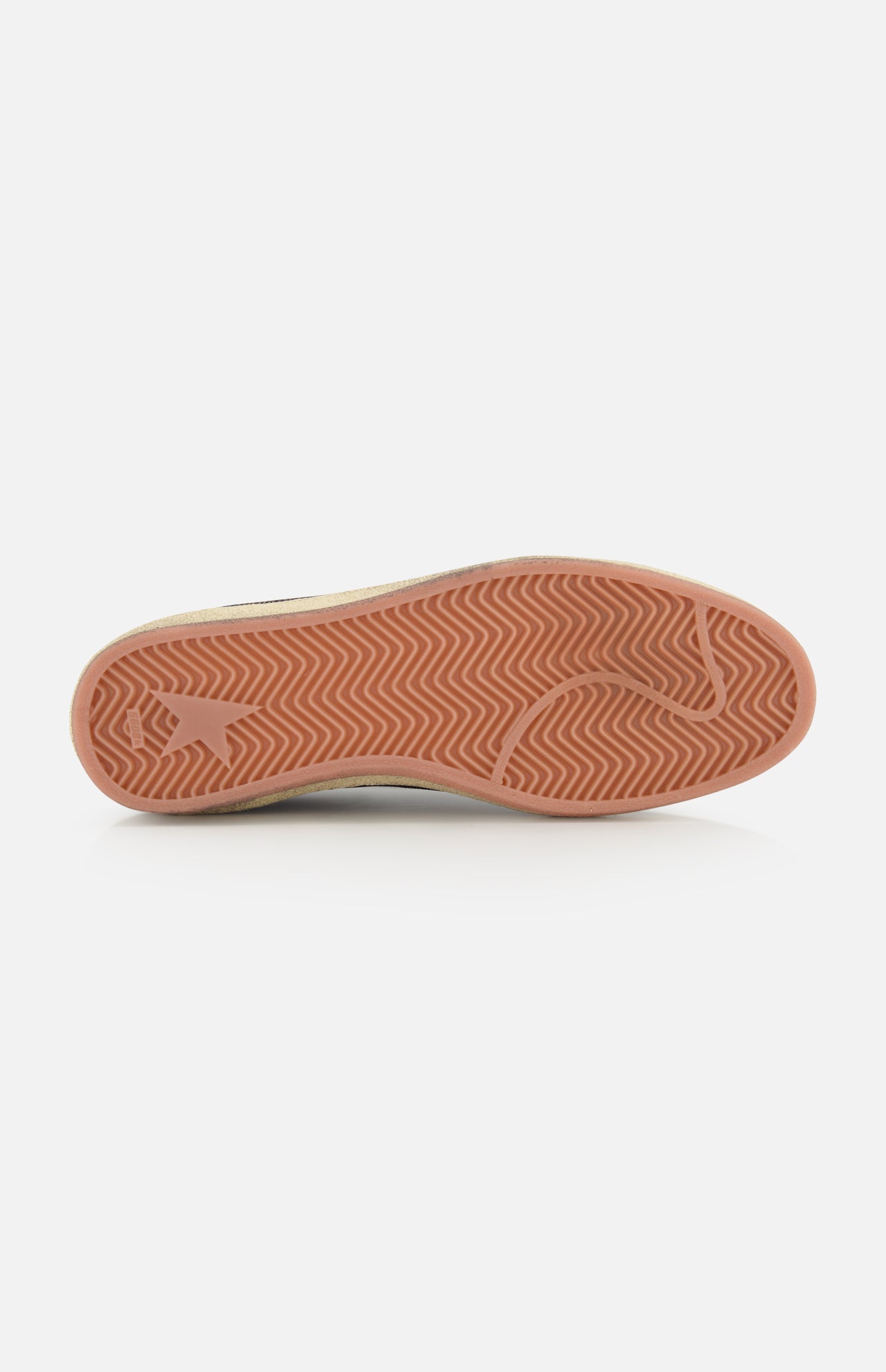 A close-up of the GOLDEN GOOSE Ballstar Suede Upper Sneaker sole shows a light reddish-brown herringbone pattern and visible logo on the scuffed bottom, set against a plain white background.