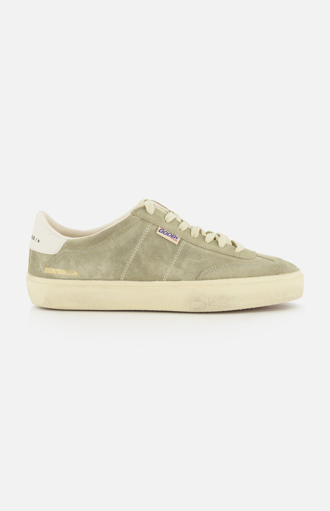 Introducing the Soul-Star Suede Sneaker by GOLDEN GOOSE—a light green suede low-top featuring an off-white sole and laces, taupe detailing on the heel, and a subtle branded tag along the side. Classic Golden Goose design is highlighted with refined gold lettering near the heel for understated elegance.