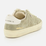 The Soul-Star Suede Sneaker by GOLDEN GOOSE features a light green premium suede upper with subtle taupe undertones, cream laces, an off-white sole, and GOLDEN GOOSE branding on the heel tab. The soft beige inner lining enhances comfort while perfectly complementing the refined color palette.