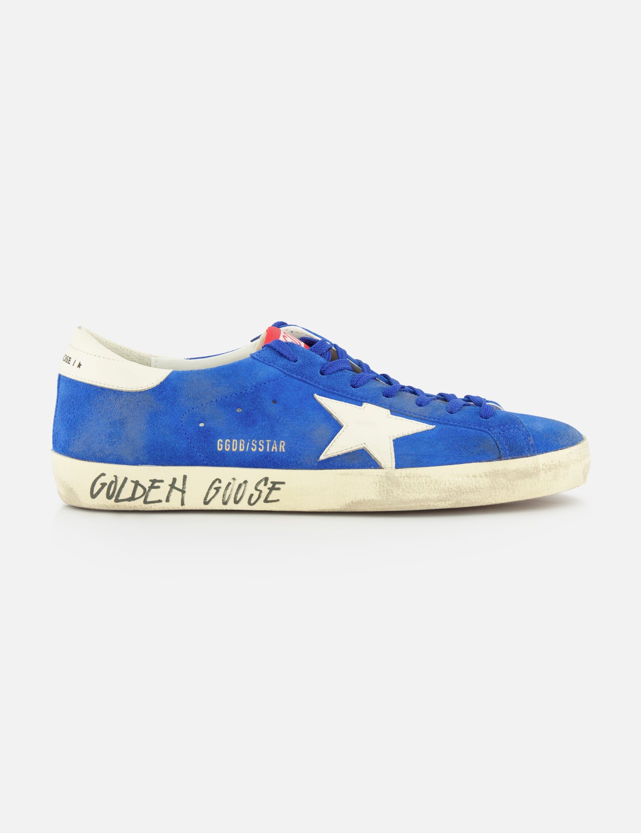 The GOLDEN GOOSE Super Star Suede Upper And Nylon Tongue Sneaker features blue suede, white laces, a white star detail, and an off-white sole with "Golden Goose" in black. Its purposely distressed look adds casual style.