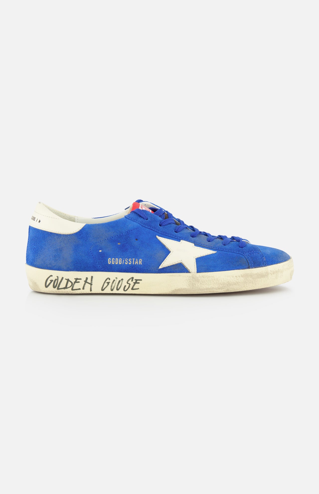 The GOLDEN GOOSE Super Star Suede Upper And Nylon Tongue Sneaker features blue suede, white laces, a white star detail, and an off-white sole with "Golden Goose" in black. Its purposely distressed look adds casual style.