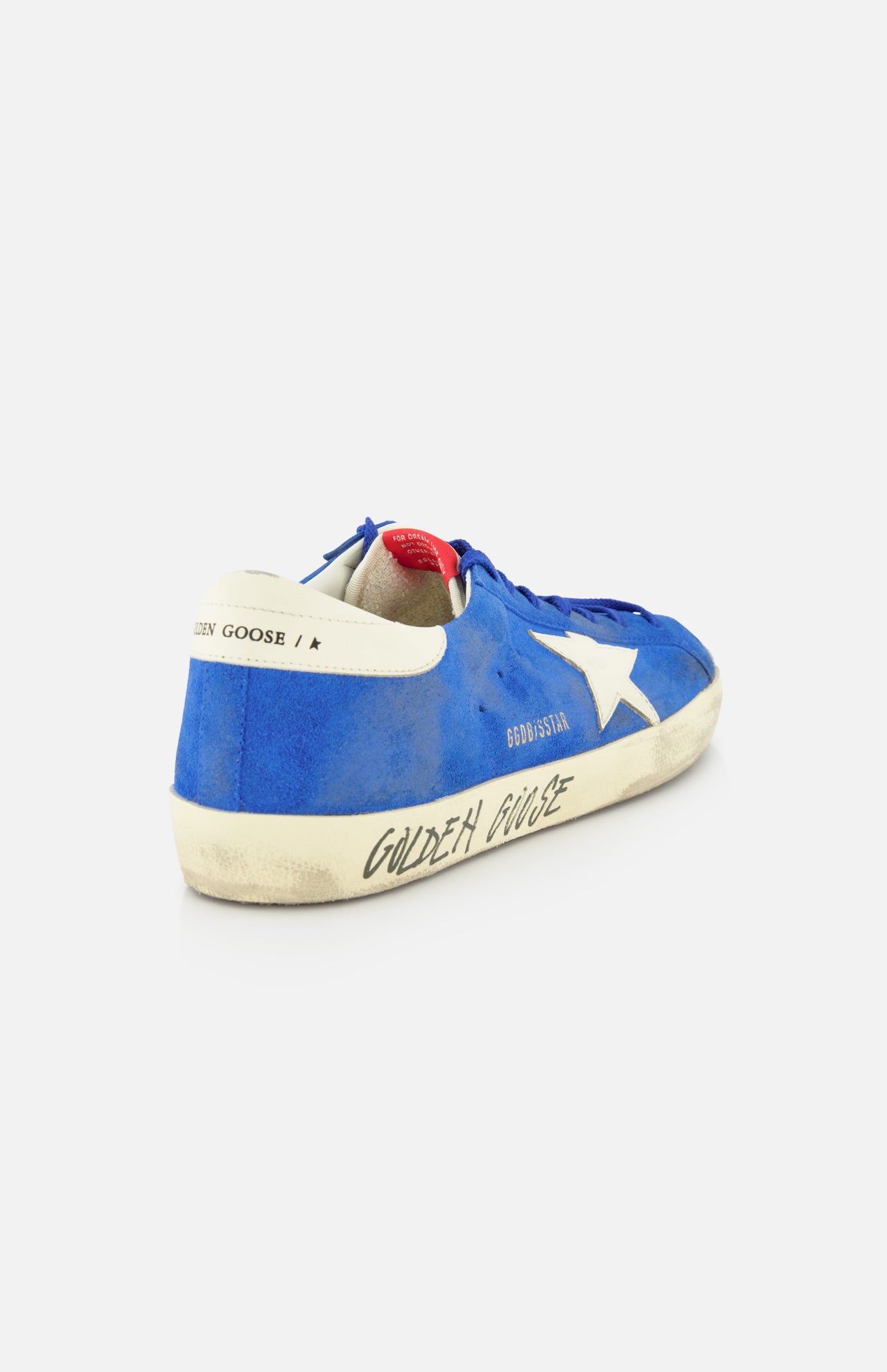 The GOLDEN GOOSE Super Star Suede Upper And Nylon Tongue Sneaker features a blue suede upper, white star, worn-in look, and "Golden Goose" on the side, with a white heel patch with black text and red inner detail for vintage style.