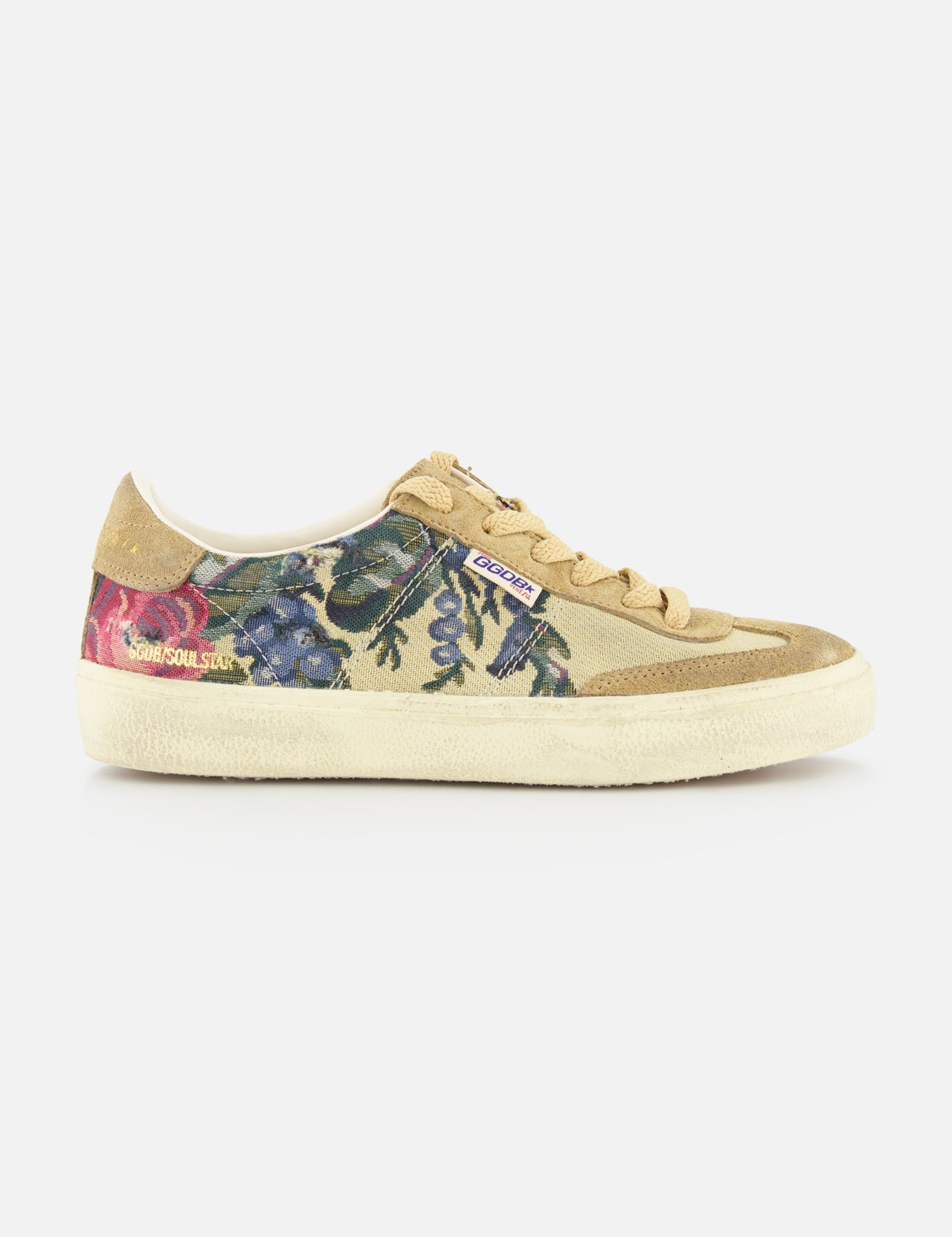 The GOLDEN GOOSE Soul-Star Canvas Sneaker features a beige canvas upper, tan laces and sole, and a botanical print with blue, purple, and pink flowers. Retro style with visible brand tags adds a signature touch.