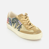The Soul-Star Canvas Sneaker by GOLDEN GOOSE features tan suede, a cream sole, tan laces, and a botanical side print with a vintage style. A small purple-and-white label near the laces adds flair. Presented on a plain white background.