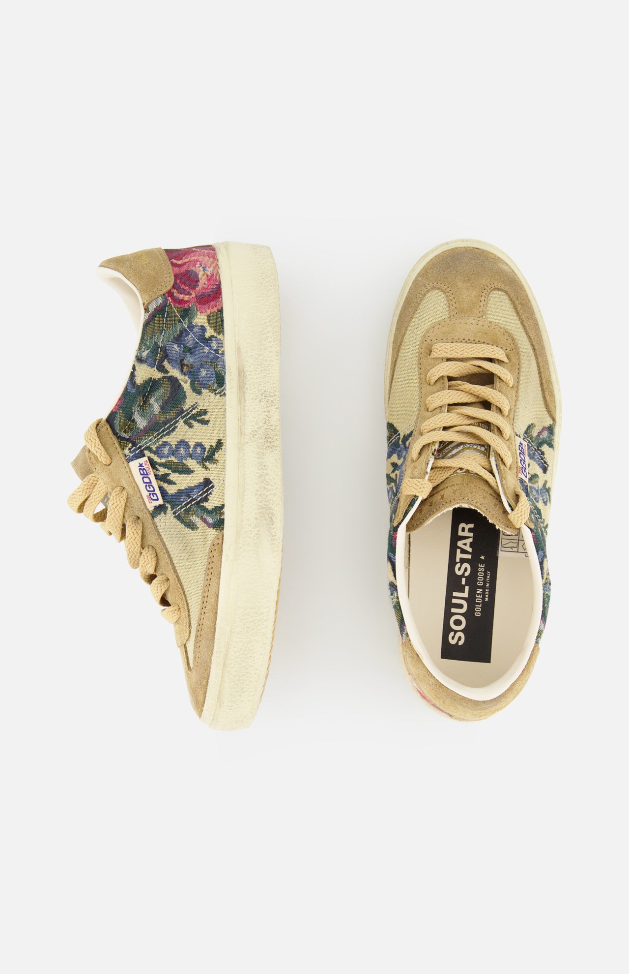 The Soul-Star Canvas Sneaker by GOLDEN GOOSE features beige suede with botanical print panels, shown from side and top views on a white background—a fresh take on classic canvas style with signature flair.