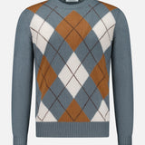 The Argyle Pattern Crewneck Sweater by GRAN SASSO is a long-sleeve, crew-neck design crafted from pure virgin wool. It showcases a blue base with an argyle pattern in brown, white, and blue diamonds, and is finished with ribbed cuffs, collar, and hem. Expertly made in Italy.