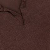 Close-up of the Johnny Collar Long Sleeve Polo Shirt by GRAN SASSO, showing its soft, subtly textured brown fabric, short placket, and a Johnny collar with the GRAN SASSO label stitched into the neckline.