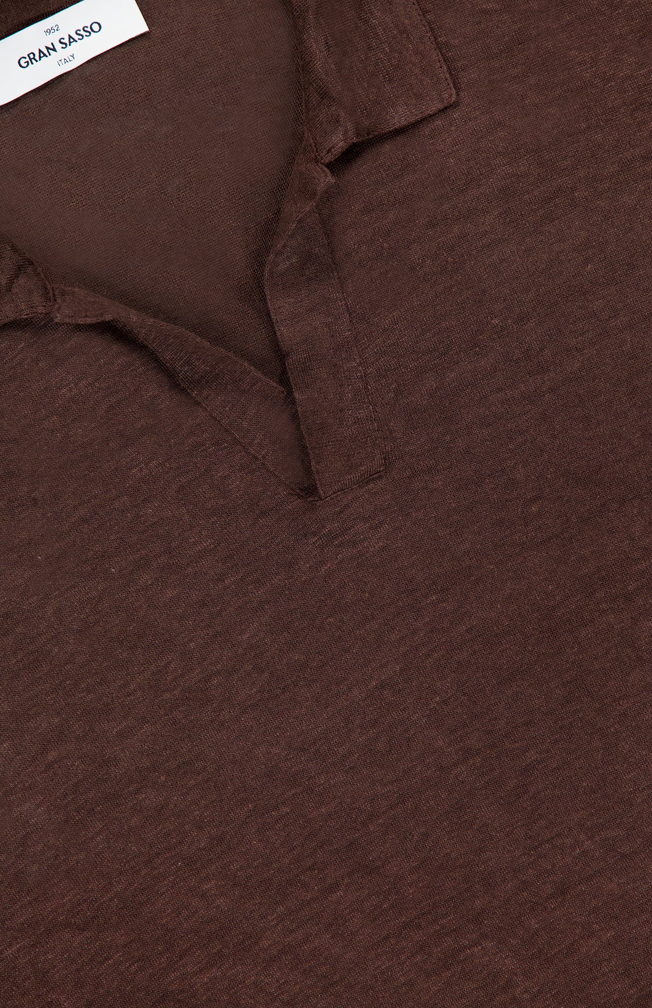 Close-up of the Johnny Collar Long Sleeve Polo Shirt by GRAN SASSO, showing its soft, subtly textured brown fabric, short placket, and a Johnny collar with the GRAN SASSO label stitched into the neckline.
