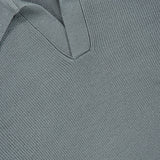 Close-up of the Johnny Collar Polo Sweater by GRAN SASSO in light green, showcasing fine knit detailing and a visible GRAN SASSO label at the neckline.