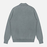 A plain, light gray Johnny Collar Polo Sweater by GRAN SASSO is laid flat with the back facing up, featuring long sleeves, ribbed cuffs, and a ribbed collar.