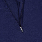 Close-up of the GRAN SASSO Quarter Zip Wool Sweater in dark blue, featuring a partially unzipped collar. A white tag inside the collar displays text indicating that this pure wool sweater is made in Italy.