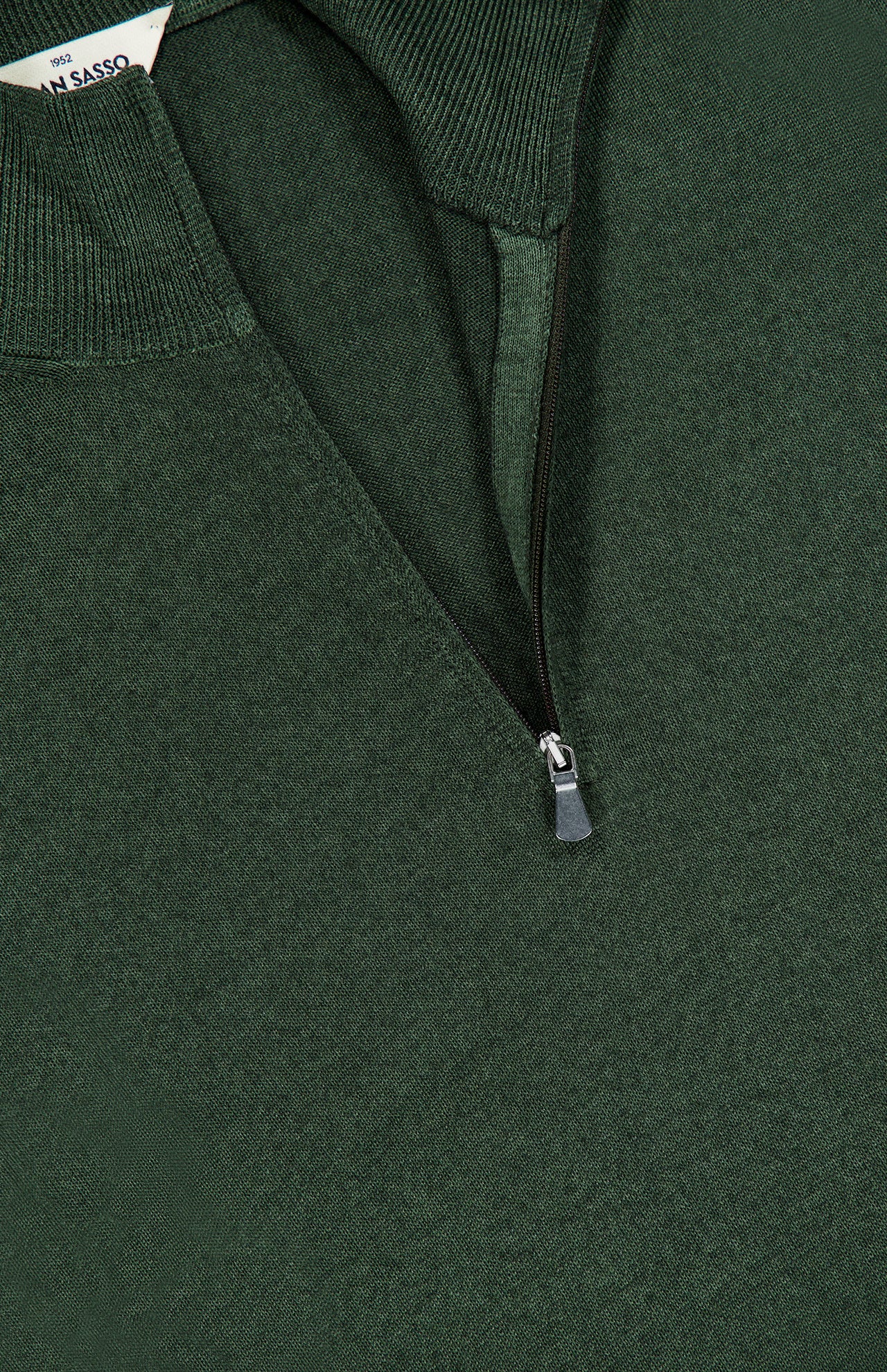 Close-up of the GRAN SASSO Quarter Zip Wool Sweater in dark green, featuring a half-zip collar. The partially open quarter zip reveals the ribbed inner collar and a glimpse of the label indicating it is made in Italy.
