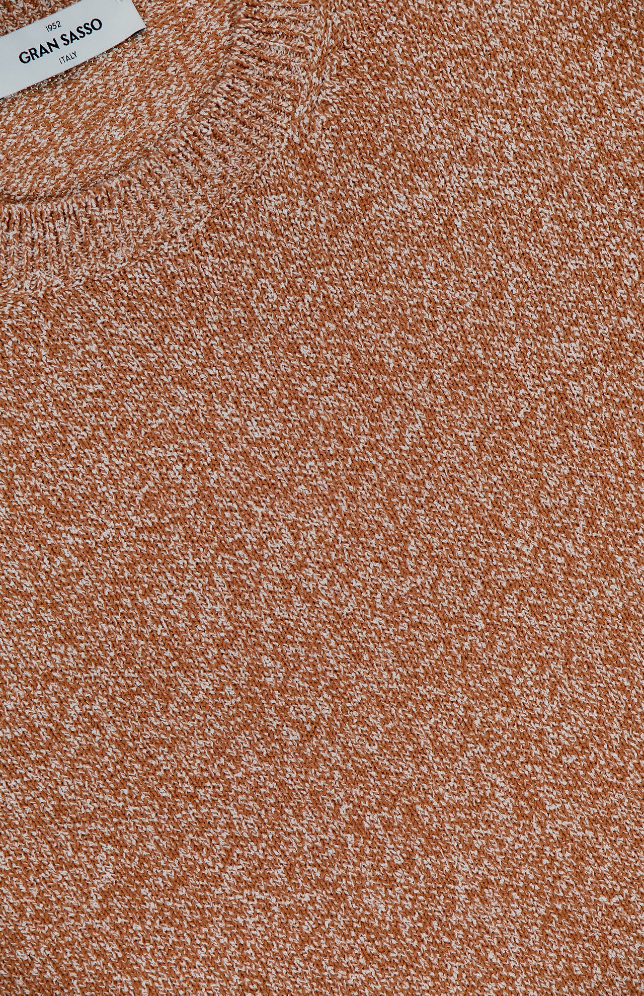 Close-up of the Speckled Crewneck Sweater in rust orange by GRAN SASSO, featuring a textured finish and visible white brand label—an ideal transitional addition to your wardrobe.