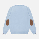 The GRAN SASSO Suede Elbow Patch Crewneck Sweater, shown in light blue and viewed from the back, is crafted from virgin wool and features brown suede elbow patches along with ribbed cuffs and hem.