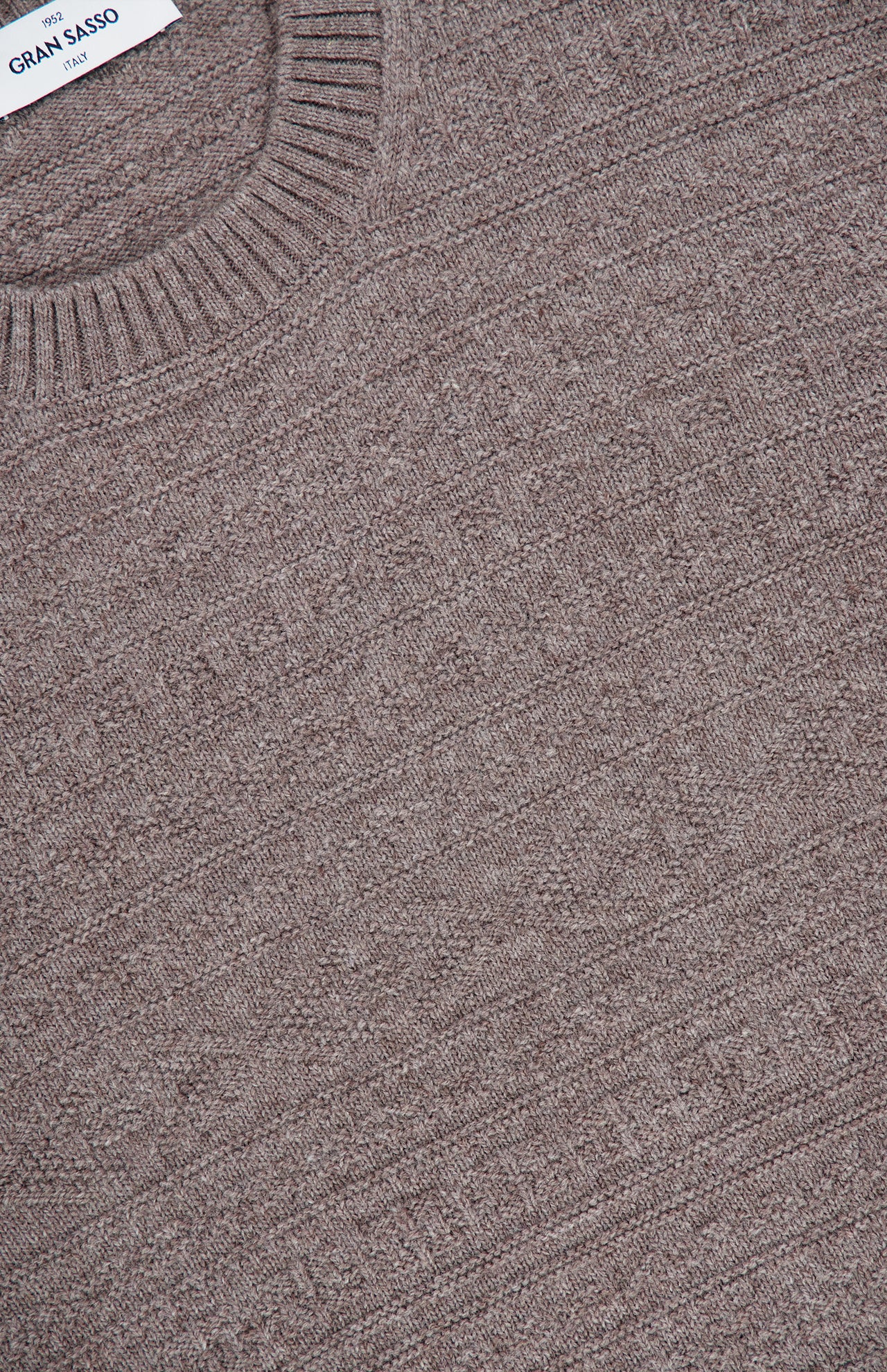 A close-up view of a brown GRAN SASSO Tonal Fair Isle Sweater, highlighting the textured fabric pattern and ribbed crew neckline.