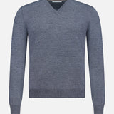 The GRAN SASSO V-Neck Virgin Wool Sweater is shown from the front on a plain white background, featuring a gray long-sleeve design with no visible logos or embellishments. Crafted in light grey virgin wool, this sweater offers timeless versatility and understated elegance.