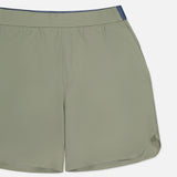The Arenac Perforated Sport Short by GREYSON features light olive green breathable fabric, an elastic waistband, mesh lining, a zip pocket, and a small navy accent on the top right, displayed on a white background.