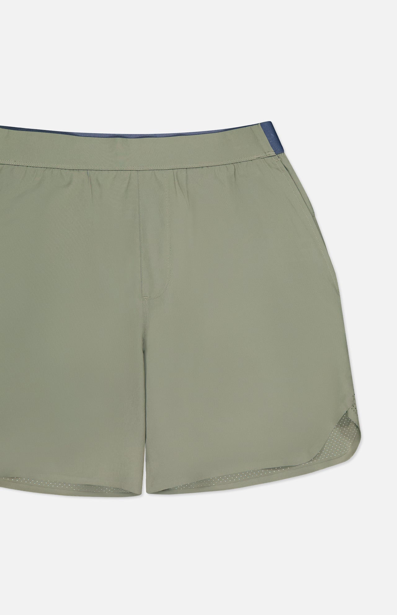 The Arenac Perforated Sport Short by GREYSON features light olive green breathable fabric, an elastic waistband, mesh lining, a zip pocket, and a small navy accent on the top right, displayed on a white background.