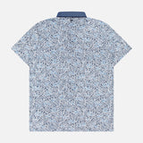 The GREYSON Buffalo Soldier Polo Shirt is a short-sleeve, button-up shirt with a blue and white abstract floral pattern, moisture-wicking fabric, and a contrasting solid blue collar for all-day comfort. Shown from the back.