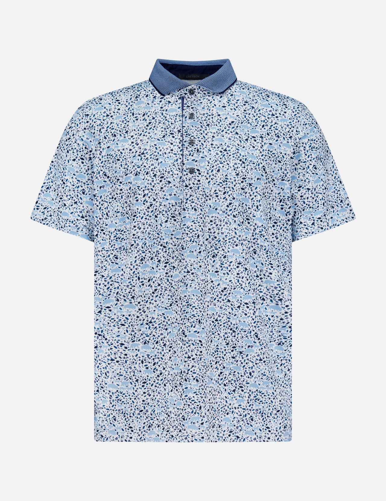 The GREYSON Buffalo Soldier Polo Shirt features a light blue, short-sleeved design with a navy collar and abstract blue and white speckled pattern. It offers a relaxed fit, button placket, moisture-wicking fabric, and built-in UV protection.