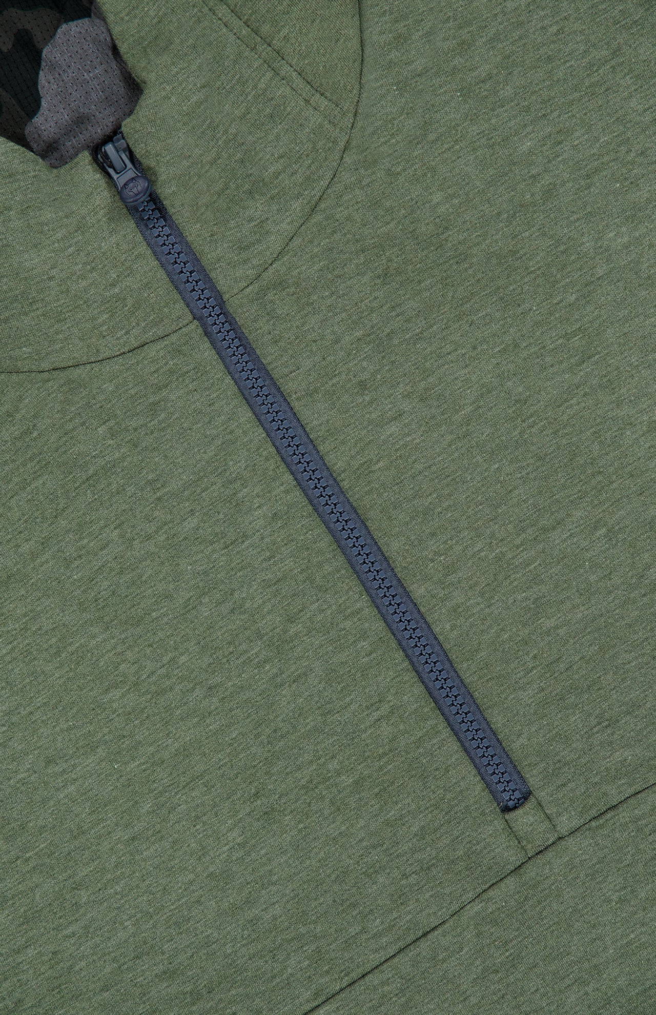 Close-up of the GREYSON Calgary Quarter Zip Hoodie Sweater in green, featuring a black zipper running vertically down the front. The top edge of the zipper reveals a glimpse of camouflage-patterned fabric beneath, while breathable yarns provide comfort and thermal insulation.