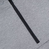 Close-up of the GREYSON Calgary Quarter Zip Sweatshirt in heather gray, featuring a black quarter-zip partially open, highlighting the fabric texture, seam detail beneath the zipper, and subtle thermal insulation for comfort.