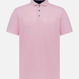 The GREYSON Crowley Polo Shirt is a light pink, collared short-sleeve performance top with three dark buttons and moisture-wicking fabric, shown on a white background.