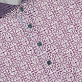 A close-up of the GREYSON Echo Falls Polo Shirt, showcasing a purple and white geometric pattern, four dark buttons, a textured contrast collar, and moisture-wicking fabric for all-day comfort.
