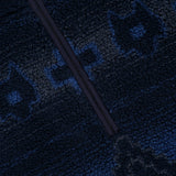 Close-up of the GREYSON Guardian Sherpa Fleece Half Zip Sweater in blue and black, featuring a textured, patterned fleece surface and a prominent black half-zip running diagonally.
