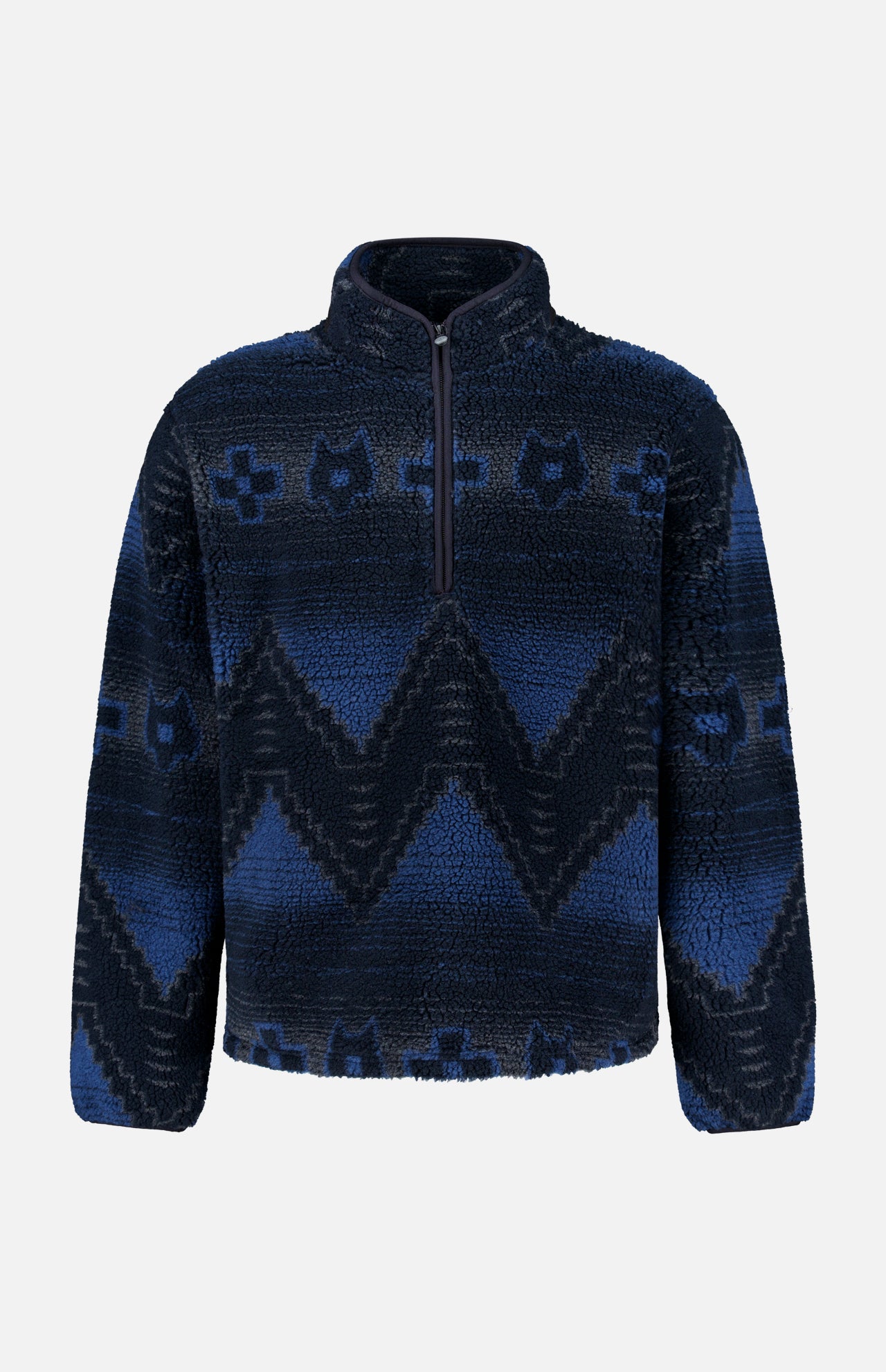 The GREYSON Guardian Sherpa Fleece Half Zip Sweater is a men’s navy blue pullover featuring a striking zigzag and abstract pattern in lighter blue shades. Designed with a quarter-zip front, long sleeves, high collar, and cozy sherpa fleece for comfort on cool days.