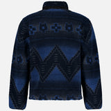 The GREYSON Guardian Sherpa Fleece Half Zip Sweater is a men’s long-sleeve jacket in blue, featuring a bold blue and black geometric pattern with zigzags and diamond shapes. Shown from the back against a plain white background.