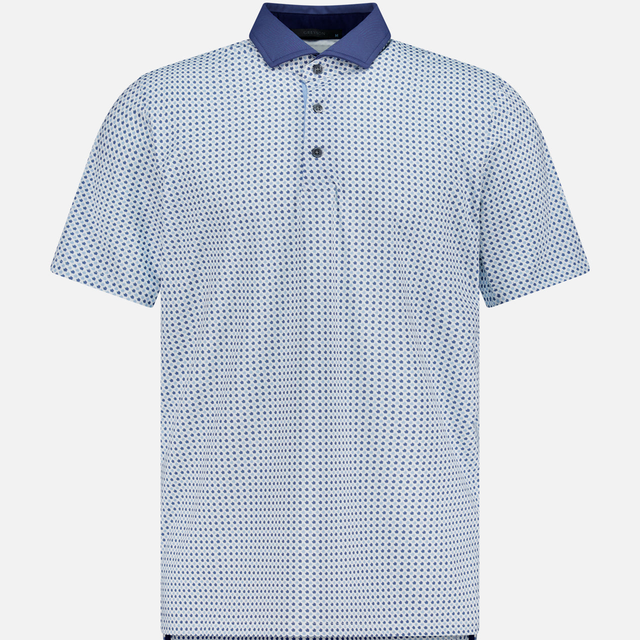 The GREYSON Ironwood Polo Shirt features a light blue short-sleeve design with a dark blue geometric pattern, button-up placket, and solid dark blue collar. Moisture-wicking fabric offers UV protection. Shown on a plain white background.