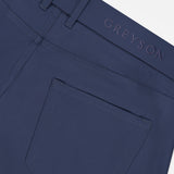 Close-up of the back pocket and waistband of the Montauk 5 Pocket Pant by GREYSON, crafted from luxurious Italian fabric, with GREYSON embroidered above the pocket.