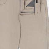 The Montauk 5 Pocket Pant by GREYSON is crafted from premium Italian fabric in beige, shown laid flat on a white background with the zipper and top button undone to reveal the inside waistband and pocket lining.
