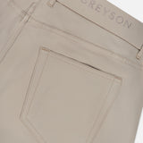 Close-up of the back pocket and waistband of the Montauk 5 Pocket Pant by GREYSON, featuring GREYSON embroidered above the pocket and crafted from premium Italian fabric for exceptional comfort and style.