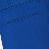 Close-up of the back of the Montauk 8-Way Stretch Trouser by GREYSON, in dark blue Italian fabric, featuring a single welt pocket with button closure and visible belt loops at the waistband.