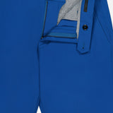 Close-up of GREYSON Montauk 8-Way Stretch Trouser in dark blue with open zipper and button, revealing gray lining and waistband. Made from Italian fabric, these trousers offer belt loops, side pockets, and refined detailing.