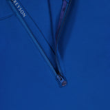 Close-up of the GREYSON Tate Quarter Zip in dark blue, featuring a partially unzipped collar that reveals the brand label. Made from Italian technical fabric, its smooth finish and matching zipper pull enhance its premium appearance.