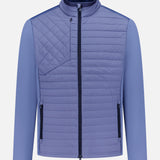 The GREYSON Yukon Hybrid Jacket is a lightweight, light purple technical jacket with Primaloft insulation, high collar, vertical zip pockets at each side, a diagonally stitched chest pocket, smooth long sleeves, and a central front zipper.