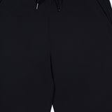 The GREYSON Phoenix Jogger is shown from waist to mid-thigh, featuring side pockets and a lightweight waistband. Its flat, smooth finish and tapered fit give these pants a simple, minimalist look.