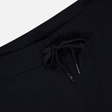 Close-up of the GREYSON Phoenix Jogger in black, showcasing its lightweight fabric and drawstring waistband with metal aglets, set against a plain white background.