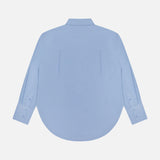 Back view of the GREYSON Ashe Button Down Shirt in light blue, featuring long sleeves, a classic collar, and curved hem. This lightweight stretch shirt is shown against a plain white background.